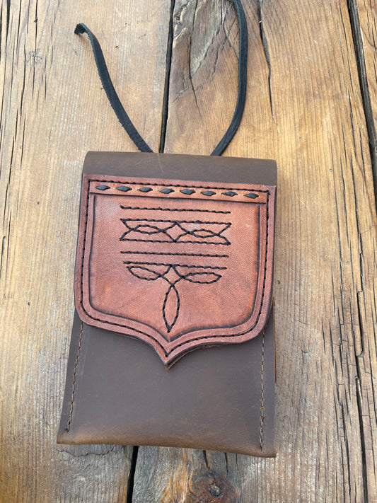 Saddle pouch cell phone holder