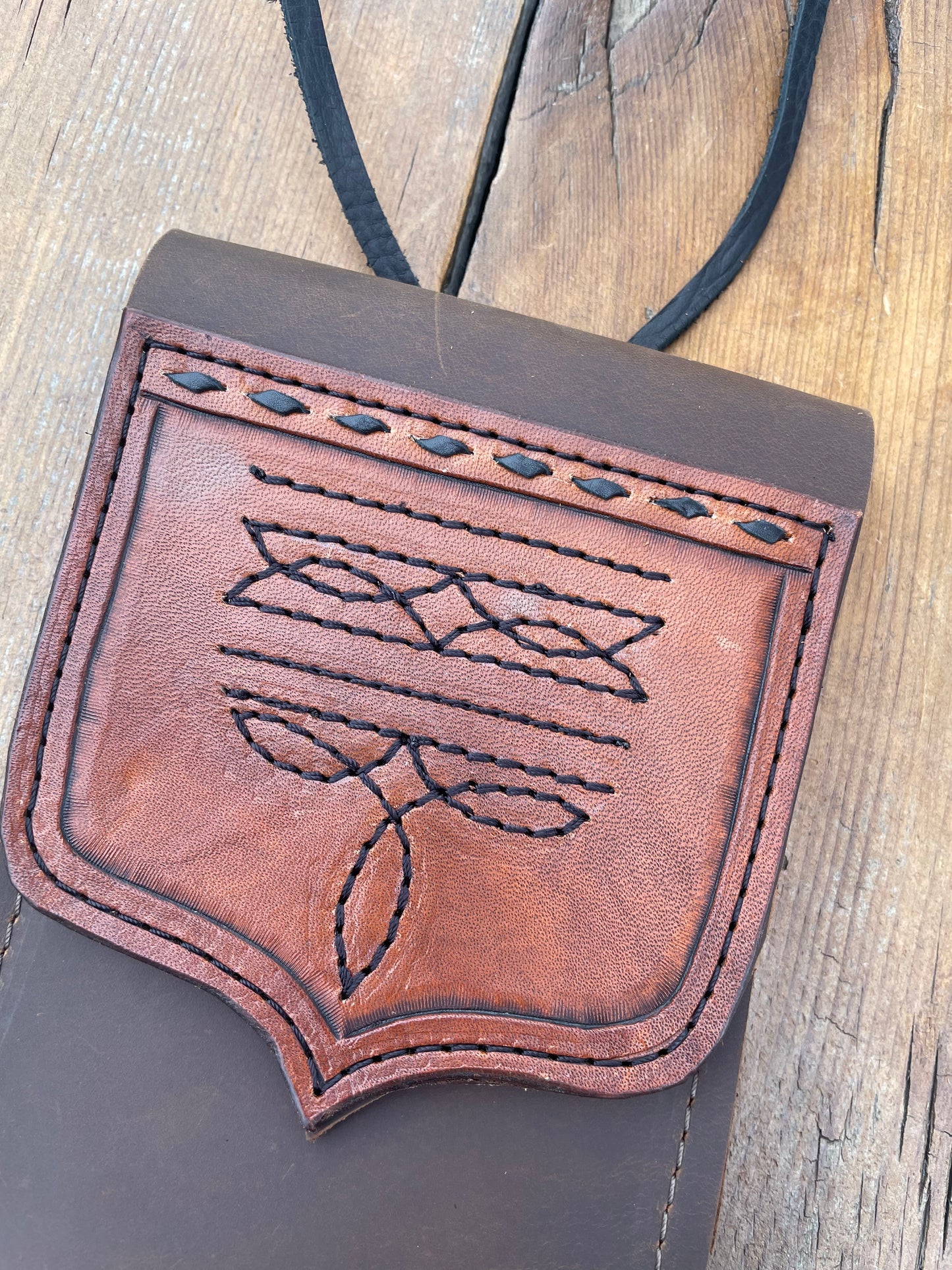 Saddle pouch cell phone holder