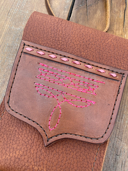Saddle pouch cell phone holder