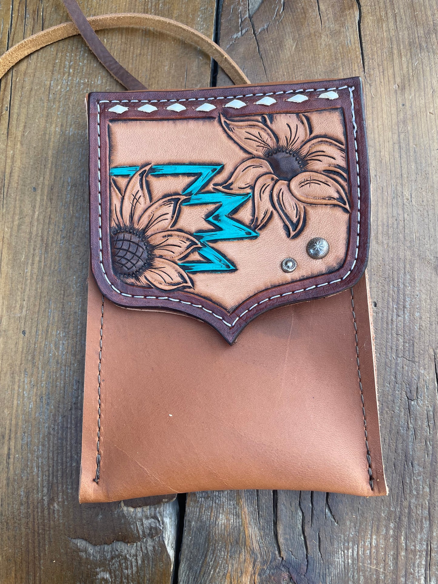 Saddle pouch cell phone holder