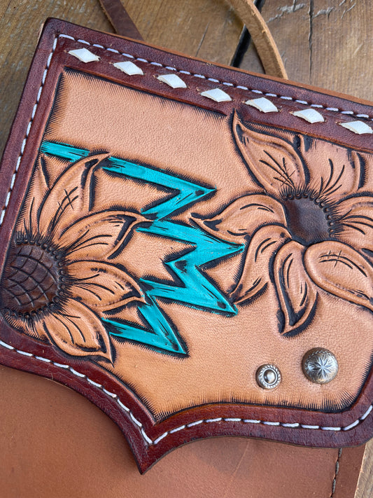 Saddle pouch cell phone holder