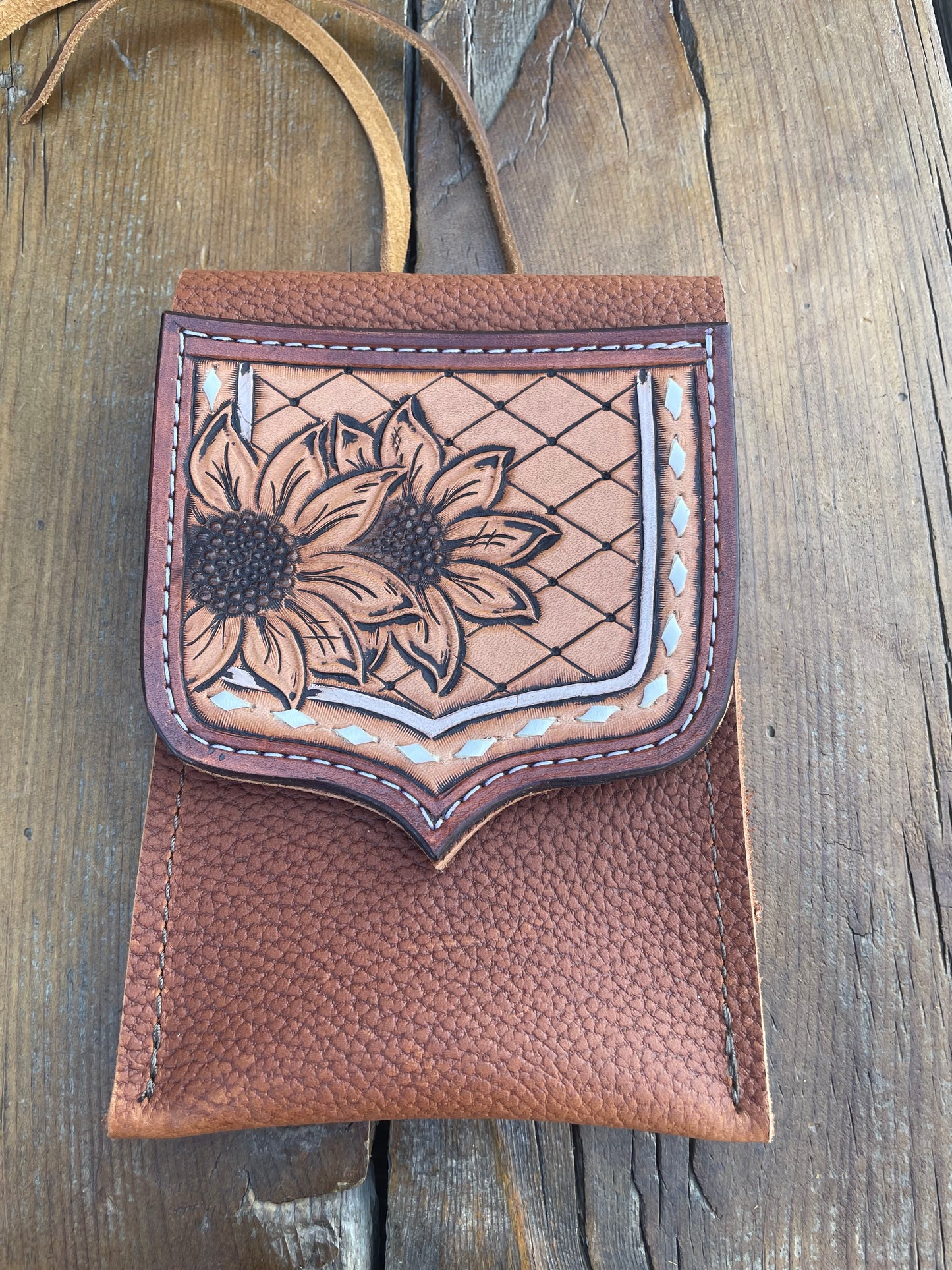 Saddle pouch cell phone holder