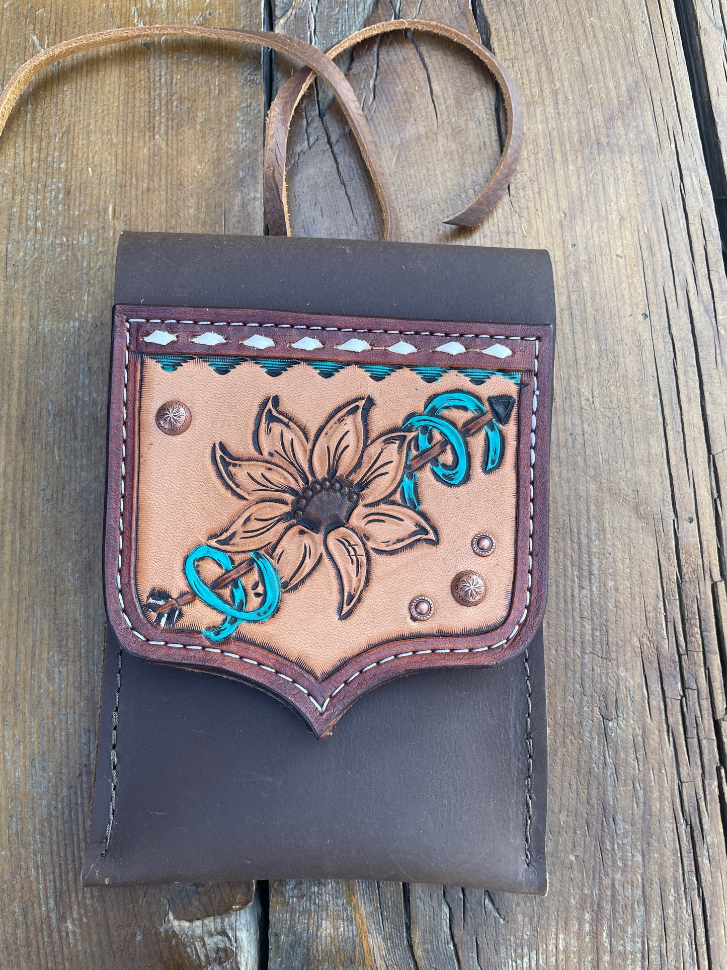 Saddle pouch cell phone holder