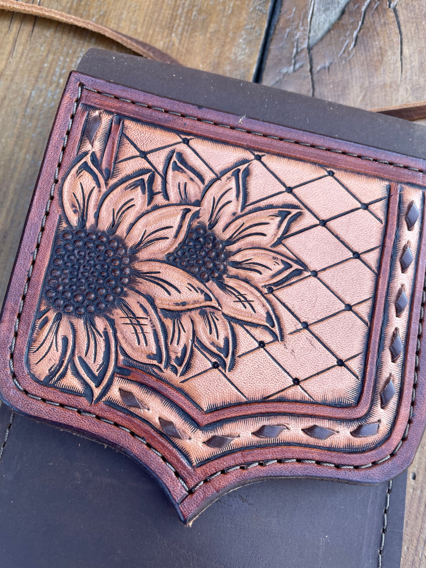 Saddle pouch cell phone holder