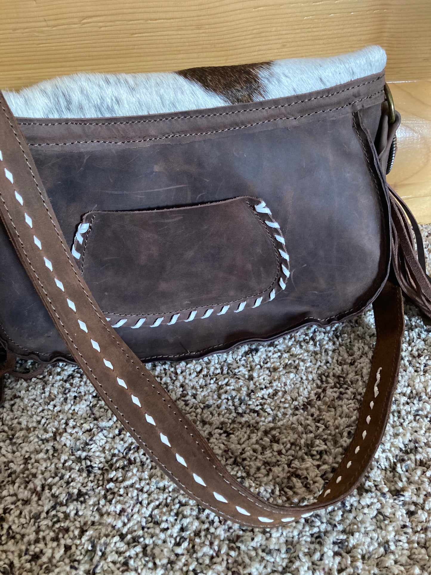 Purse with cowhide flap